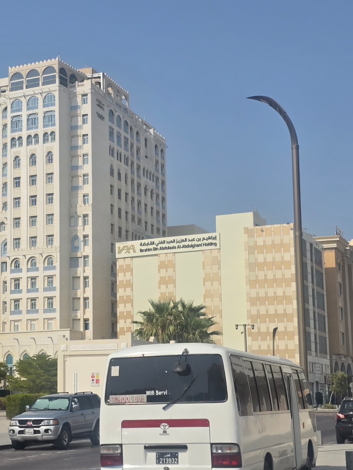 Street view of the Ibrahim Bin Abdulaziz Al-Abdulghani Holding building on Al Mahar Street, Doha — Dream International is on the 2nd floor